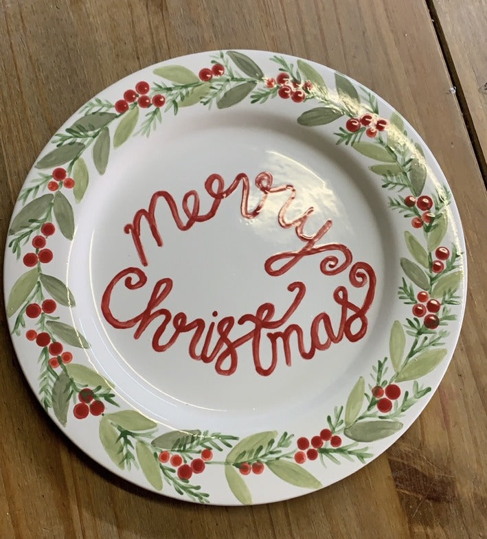 Previous hand-painted ceramic Christmas plate with red Merry Christmas lettering and botanical berry border