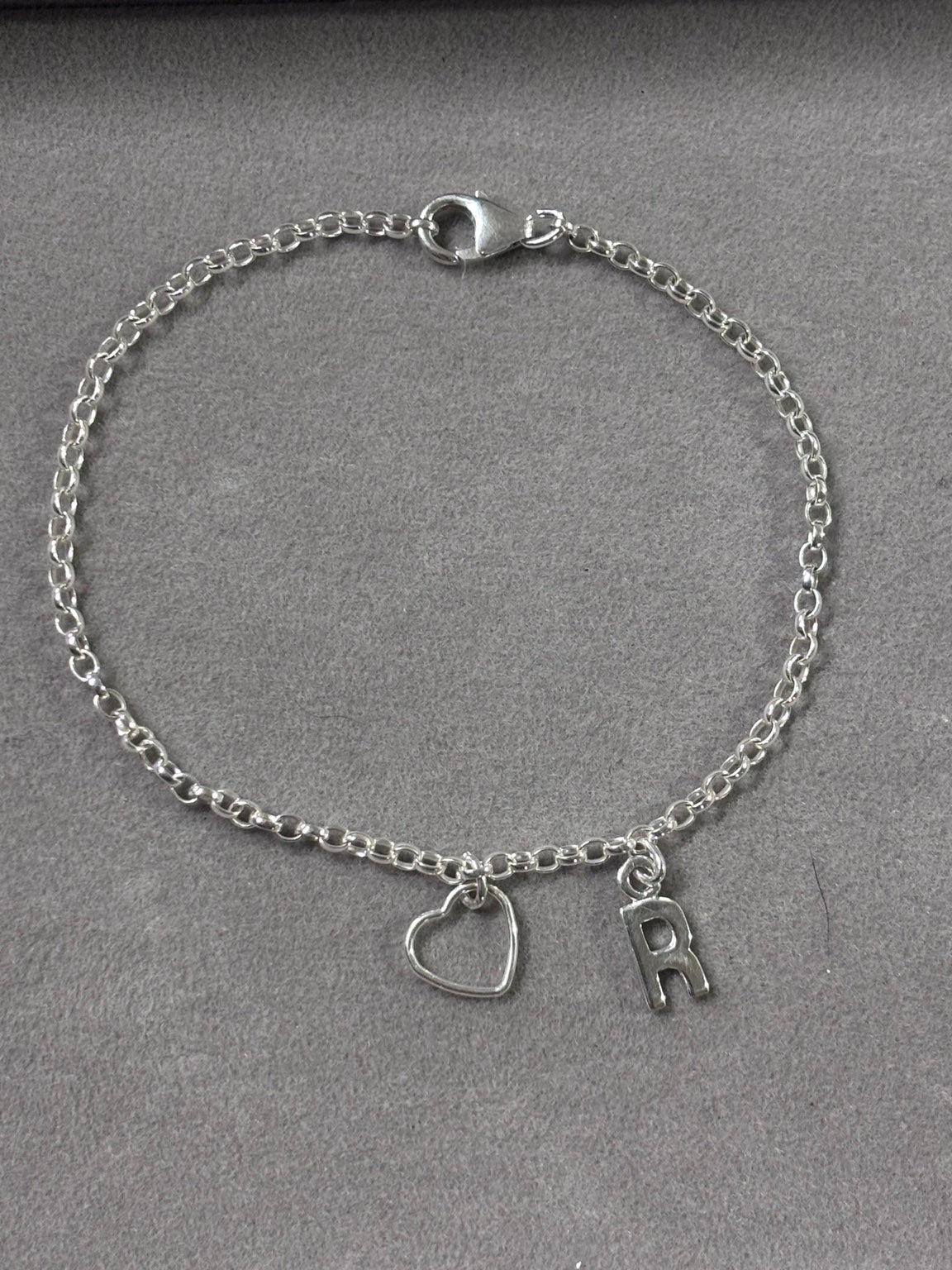 Personalised 925 sterling silver bracelet with oval belcher chain, open heart charm and letter R initial, full view